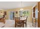 Cozy dining area with natural lighting and room for hosting, complemented by a display cabinet at 12952 Downstream Cir, Orlando, FL 32828