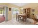 Inviting dining area featuring a bay window with scenic views, perfect for enjoying meals at 12952 Downstream Cir, Orlando, FL 32828