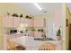 Charming kitchen featuring countertops, microwave, toaster and light-toned cabinets at 12952 Downstream Cir, Orlando, FL 32828