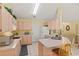 Functional kitchen featuring ample counter space and bright-colored cabinetry at 12952 Downstream Cir, Orlando, FL 32828