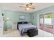 Main bedroom featuring light walls, slider door access, and tile flooring at 12952 Downstream Cir, Orlando, FL 32828