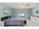 Serene main bedroom boasts tile floor, slider door access and bright lighting at 12952 Downstream Cir, Orlando, FL 32828
