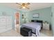 Spacious main bedroom featuring neutral tones, tile floor, and ceiling fan at 12952 Downstream Cir, Orlando, FL 32828