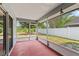 Enclosed patio with a view of the backyard and lots of light, creating a cozy spot to relax at 12952 Downstream Cir, Orlando, FL 32828