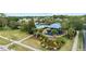 Aerial view of Waterford Lakes Recreation Center featuring a pool, playground, and lush landscaping at 12952 Downstream Cir, Orlando, FL 32828
