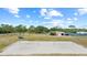 Aerial view of the sand volleyball court with community buildings and recreational facilities in the background at 12952 Downstream Cir, Orlando, FL 32828