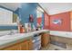 Bright bathroom featuring double sinks, bath tub, and colorful walls for a vibrant feel at 13009 Plum Lake Cir, Minneola, FL 34715