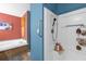 Well-equipped bathroom with separate shower, tub, and ample storage space for toiletries at 13009 Plum Lake Cir, Minneola, FL 34715
