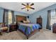 Relaxing bedroom with a cozy bed, classic wooden furniture, and soft lighting at 13009 Plum Lake Cir, Minneola, FL 34715