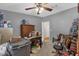 Bedroom with neutral walls, ceiling fan, and lots of stuff at 13009 Plum Lake Cir, Minneola, FL 34715