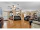 Open-concept living room with hardwood floors and a view of other rooms at 13009 Plum Lake Cir, Minneola, FL 34715