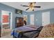 Stylish main bedroom boasting an en-suite bathroom and a beautiful color palette at 13009 Plum Lake Cir, Minneola, FL 34715