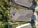 Aerial view of home, putting green, and wooded area at 14138 Alafaya Oak Bnd, Orlando, FL 32828