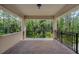 Secluded outdoor balcony with stunning forest views and brick flooring at 14138 Alafaya Oak Bnd, Orlando, FL 32828