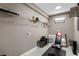 A basement room with weightlifting equipment, shelving and a window at 14138 Alafaya Oak Bnd, Orlando, FL 32828