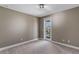 Bedroom featuring carpet and door leading to a balcony with railings at 14138 Alafaya Oak Bnd, Orlando, FL 32828