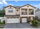 Charming two-story home featuring a front-facing balcony and a three car garage at 14138 Alafaya Oak Bnd, Orlando, FL 32828