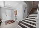 Bright foyer with staircase and elegant decor at 14138 Alafaya Oak Bnd, Orlando, FL 32828