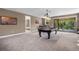Spacious game room with pool table and access to a bedroom at 14138 Alafaya Oak Bnd, Orlando, FL 32828