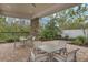 Outdoor community grill area with tables and chairs, perfect for gatherings at 14138 Alafaya Oak Bnd, Orlando, FL 32828