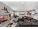 Open-concept living room with modern decor and a view of the kitchen at 14138 Alafaya Oak Bnd, Orlando, FL 32828