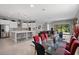 Spacious living and dining area featuring recessed lighting, tile floors, and an island kitchen at 14138 Alafaya Oak Bnd, Orlando, FL 32828