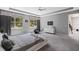 Carpeted main bedroom with natural light, neutral walls and contemporary furniture at 14138 Alafaya Oak Bnd, Orlando, FL 32828
