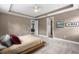 Spacious main bedroom with tray ceiling, neutral walls, and plush carpet at 14138 Alafaya Oak Bnd, Orlando, FL 32828