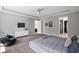 Large main bedroom features carpet flooring, a tray ceiling, and lots of natural light at 14138 Alafaya Oak Bnd, Orlando, FL 32828