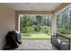 The brick patio overlooks a putting green in the backyard at 14138 Alafaya Oak Bnd, Orlando, FL 32828