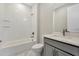 Bathroom featuring a shower-tub combo, neutral vanity, and bright lighting at 1459 Santorini Way, Tavares, FL 32778