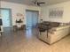 Comfortable living room with a reclining sofa, neutral tones, and a ceiling fan at 1832 Katz Crossing Dr, Kissimmee, FL 34744