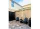 Cozy patio space with comfortable seating, an umbrella table, and a convenient outdoor grill at 1832 Katz Crossing Dr, Kissimmee, FL 34744