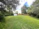 This spacious, landscaped backyard offers a shed for extra storage at 196 Morning Glory Dr, Lake Mary, FL 32746