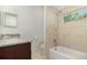 Well-lit bathroom featuring granite countertops, neutral-tone tiling, and a shower-tub combo at 196 Morning Glory Dr, Lake Mary, FL 32746