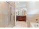 Bathroom featuring glass shower, soaking tub and double sink vanity with granite countertop at 196 Morning Glory Dr, Lake Mary, FL 32746