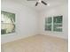 Bright bedroom with tile flooring and windows allowing ample natural light at 196 Morning Glory Dr, Lake Mary, FL 32746