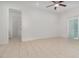 Bright bedroom with tile flooring, ceiling fan, and access to connecting rooms at 196 Morning Glory Dr, Lake Mary, FL 32746