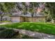 Charming single-story home with a well-maintained lawn and mature trees, creating a welcoming curb appeal at 196 Morning Glory Dr, Lake Mary, FL 32746