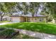 Charming single-story home with a well-maintained lawn and mature trees, creating a welcoming curb appeal at 196 Morning Glory Dr, Lake Mary, FL 32746