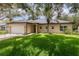 Charming single-story home features a well-maintained lawn, mature trees, and a two-car garage at 196 Morning Glory Dr, Lake Mary, FL 32746