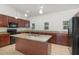 Modern kitchen featuring granite countertops, stainless steel appliances, and a center island with a sink at 196 Morning Glory Dr, Lake Mary, FL 32746
