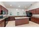 Bright open kitchen with granite countertops, center island with sink, and stainless steel appliances at 196 Morning Glory Dr, Lake Mary, FL 32746