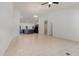 Open-concept living room with tile flooring, high ceilings, and seamless access to the kitchen area at 196 Morning Glory Dr, Lake Mary, FL 32746