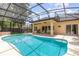 The screened-in pool area features a custom pool, BBQ, and outdoor patio seating at 196 Morning Glory Dr, Lake Mary, FL 32746