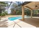 The screened-in pool area features a custom pool, BBQ, and outdoor patio seating at 196 Morning Glory Dr, Lake Mary, FL 32746