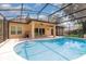 This screened-in pool area features a sparkling pool and covered lanai at 196 Morning Glory Dr, Lake Mary, FL 32746