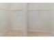 Spacious walk-in closet with white wire shelving and tile flooring at 196 Morning Glory Dr, Lake Mary, FL 32746