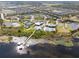 Beautiful aerial view of a residential area with pool, clubhouse, and lake pier at 2301 Datura Loop, St Cloud, FL 34772