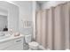 Bathroom with a shower, a vanity with a sink, and a toilet at 2301 Datura Loop, St Cloud, FL 34772